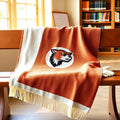 Two-color woven school mascot throw blanket in cream and muted rust